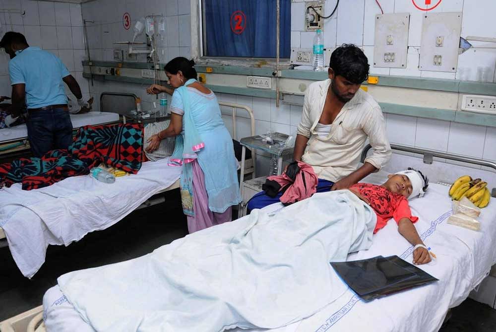 Injured victims of train accident being treated at a hospital in Amritsar on Friday. Officials said at least 60 bodies have been found and many more injured have been admitted to a government hospital after the accident near the site of Dussehra festivities. PTI Photo