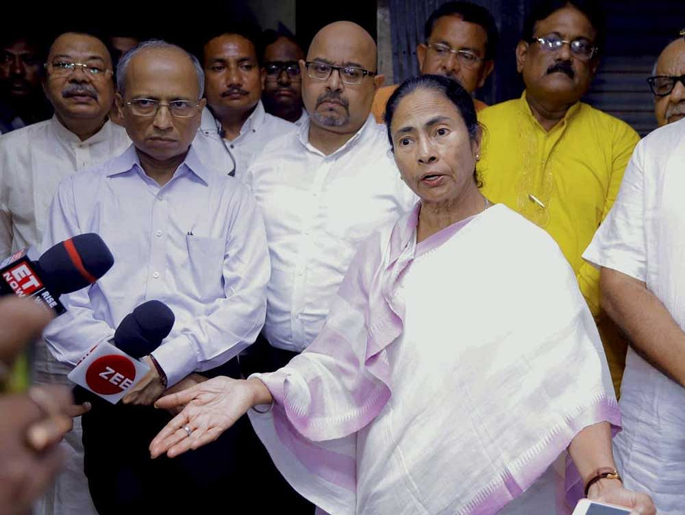 West Bengal Chief Minister Mamata Banerjee interacts with the media after visiting injured victims of the Howrah Station stampede at a hospital, in Howrah. PTI Photo