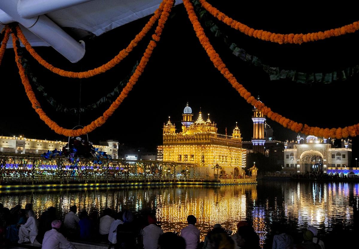 An illuminated Sri Harmandir Sahib (Golden Temple) on the eve of the 484th birth anniversary of fourth Sikh Guru, Guru Ramdass Ji, in Amritsar. PTI Photo