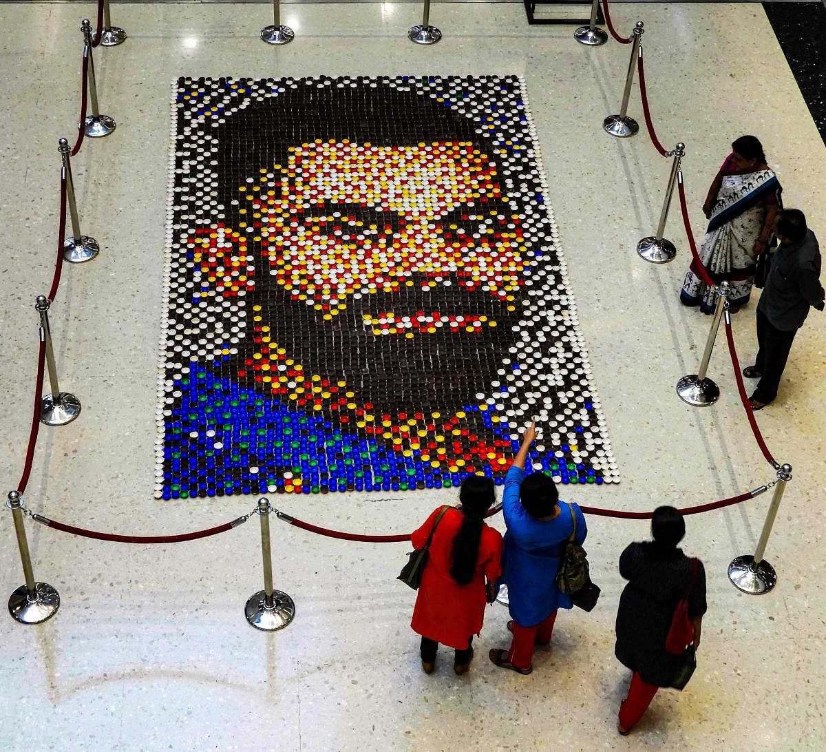 A diya mosaic created by artist Abaasaheb Shewale forming a portrait of Indian cricketer Virat Kohli ahead of his birthday, at a mall, in Mumbai, Tuesday, Oct 30, 2018. (PTI Photo)