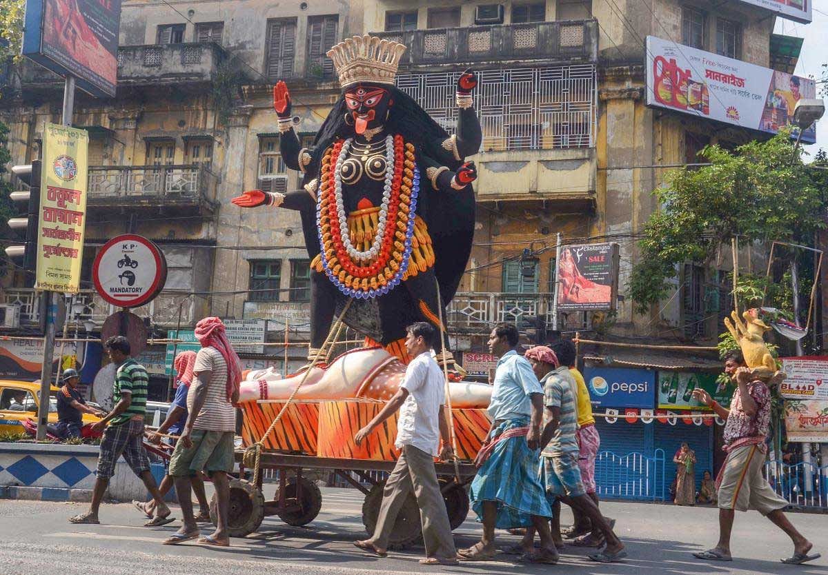 An idol of goddess Kali is carried to puja pandal ahead Kali Puja & Diwali festival, in Kolkata, Saturday, Nov 3, 2018. (PTI Photo)
