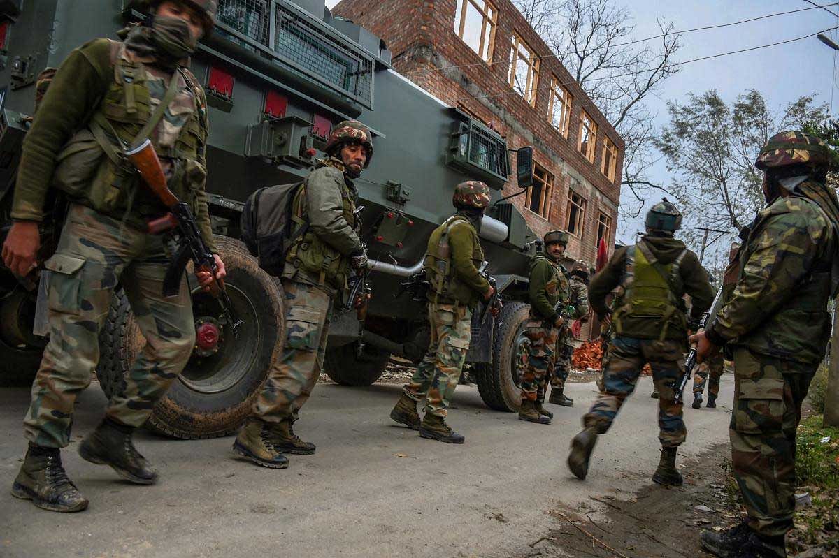 Army soldiers during cordon and search operation at Bakoora on the outskirts of Srinagar, on Monday, November 5, 2018. According to police, a cordon and search operation was launched after they received specific information about the presence of terrorists in Bakoora village, following which the militants opened fire. PTI Photo