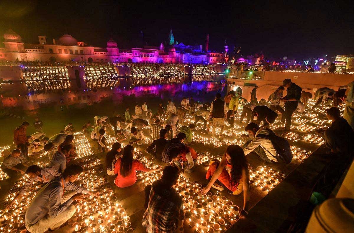 People light earthen lamps on the banks of River Saryu during Deepotsav (grand Diwali celebrations) in Ayodhya, Tuesday, Nov 6 2018. PTI Photo