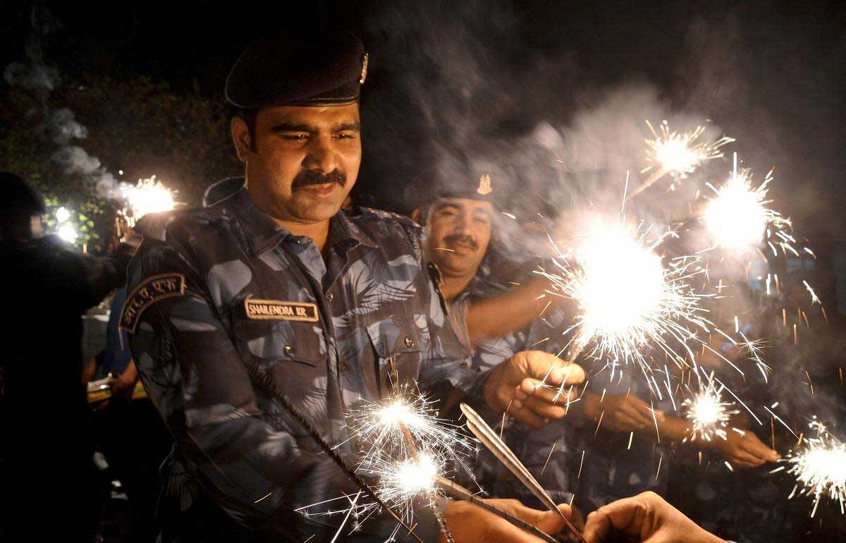 RAF (Rapid Action Force) jawans celebrating Diwali festival in Jabalpur on Tuesday night, Nov, 06 2018, (PTI Photo )