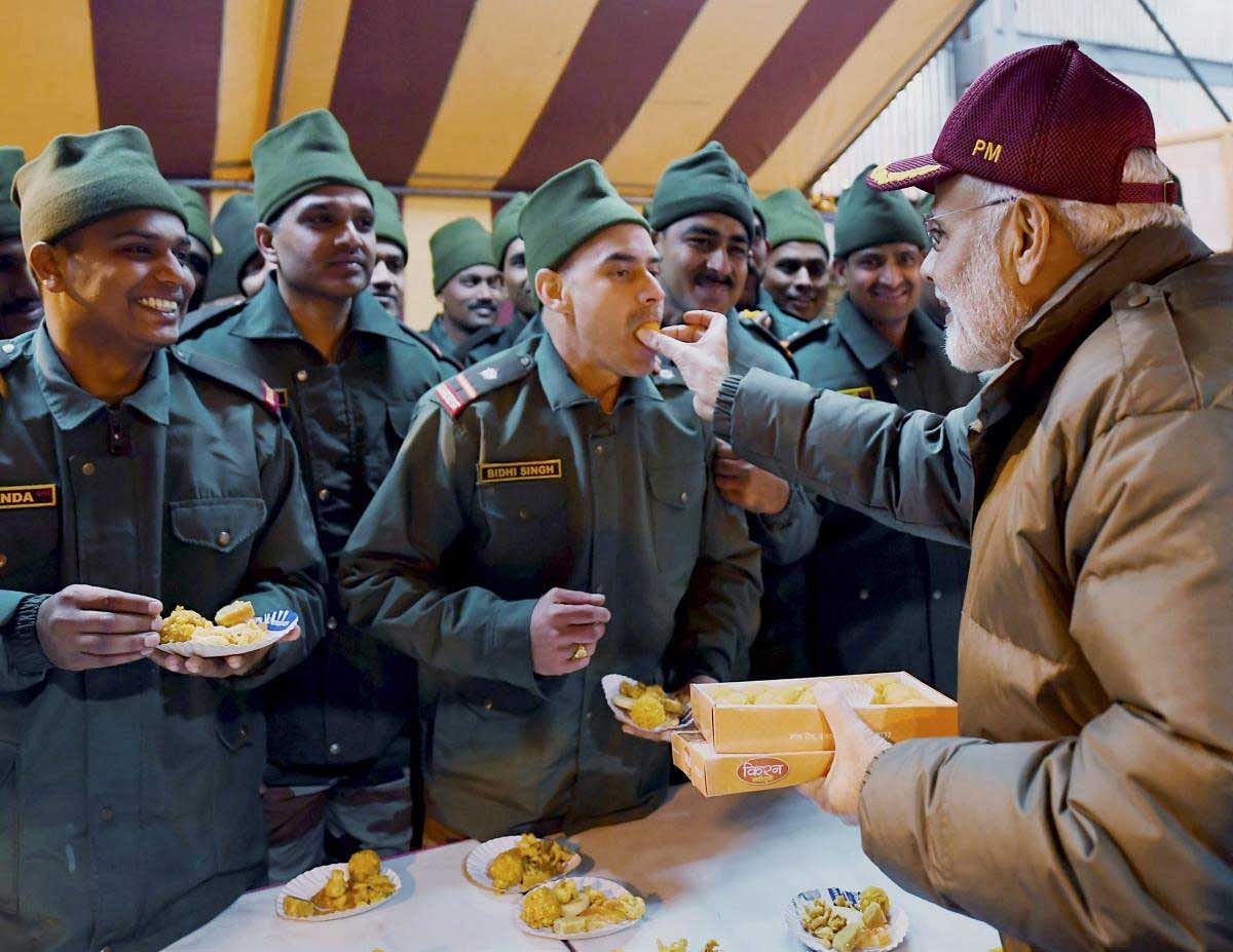 Prime Minister Narendra Modi celebrating Diwali with the jawans of the Indian Army and ITBP, at Harsil, in Uttarakhand on Wednesday, Nov. 07, 2018. (PIB Photo via PTI)