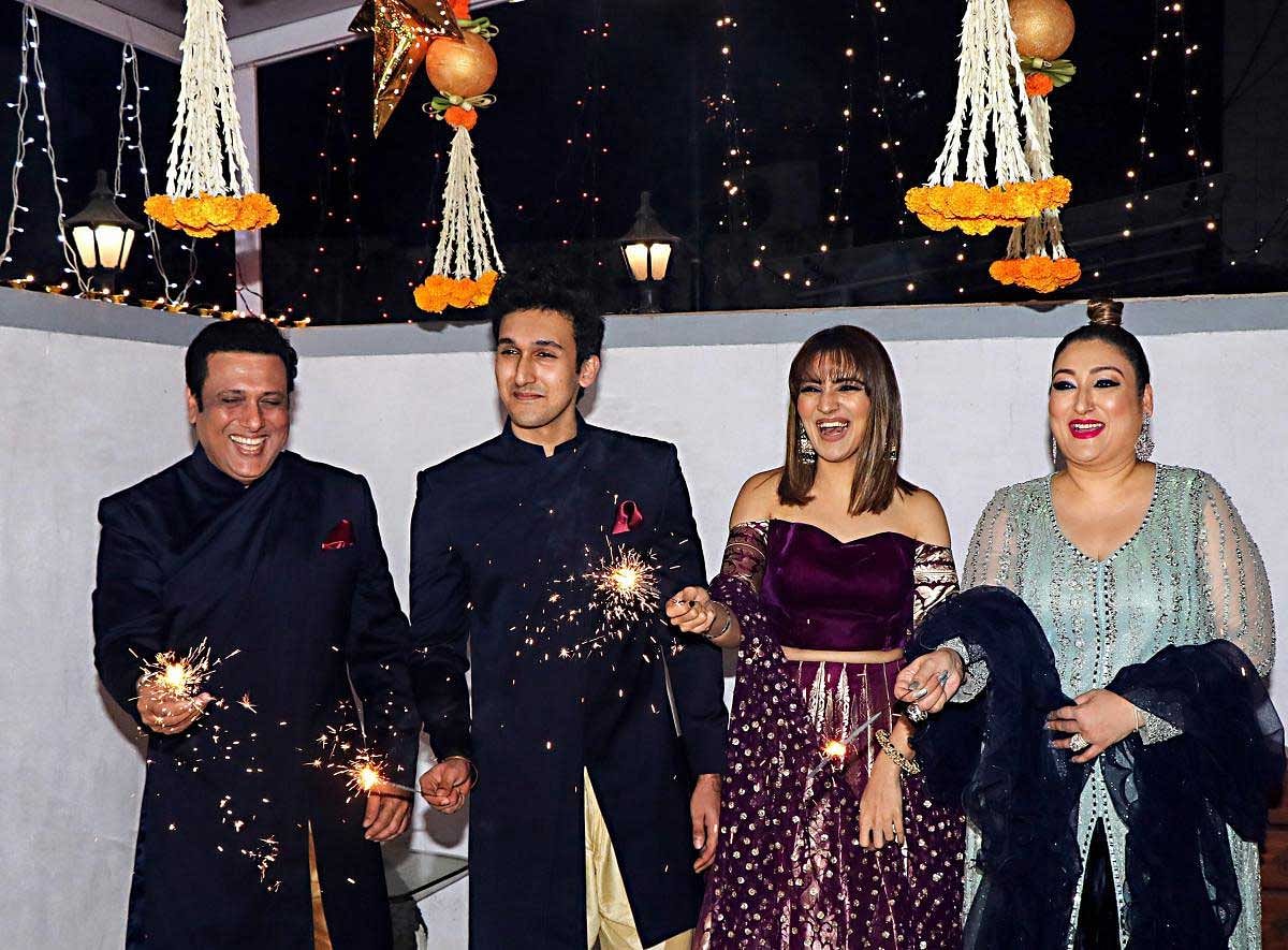 Bollywood actor Govinda with his son Yashvardan, daughter Tina and wife Sunita Ahuja during the Diwali celebrations 2018 in Mumbai, Wednesday, November 7, 2018. (PTI Photo)