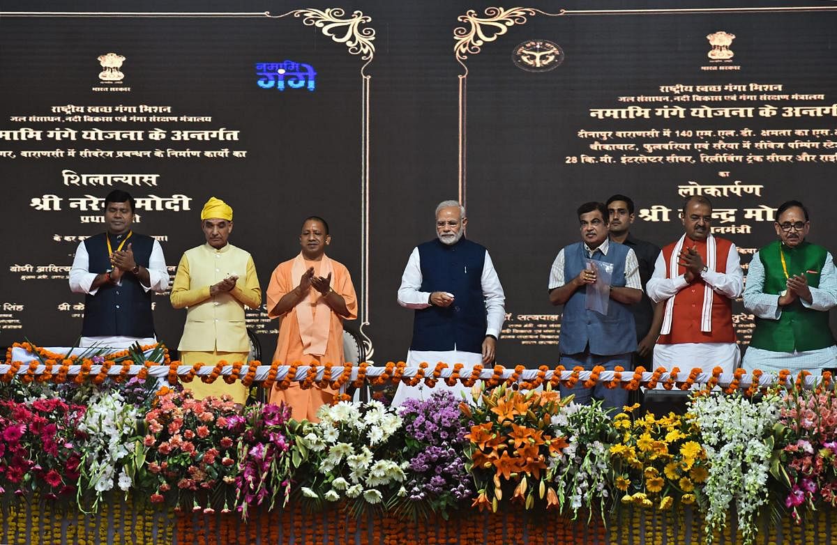 Prime Minister Narendra Modi inaugurates two major national highways and an inland waterways project, in Varanasi, Monday, Nov 12, 2018. Also seen are Union Transport Minister Nitin Gadkari and Uttar Pradesh Chief Minister Yogi Adityanath among others. (PTI Photo)