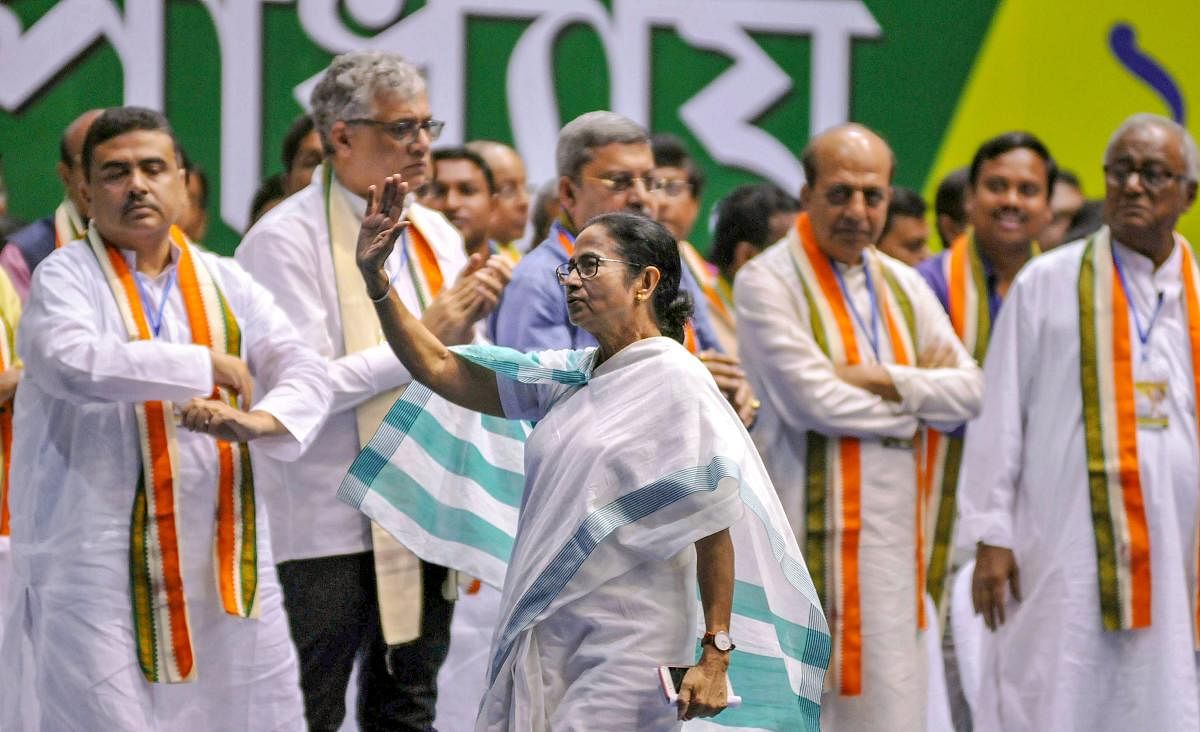 Trinamool Congress supremo and West Bengal Chief Minister Mamata Banerjee waves at party workers during an extended General Council Meeting, in Kolkata. PTI photo