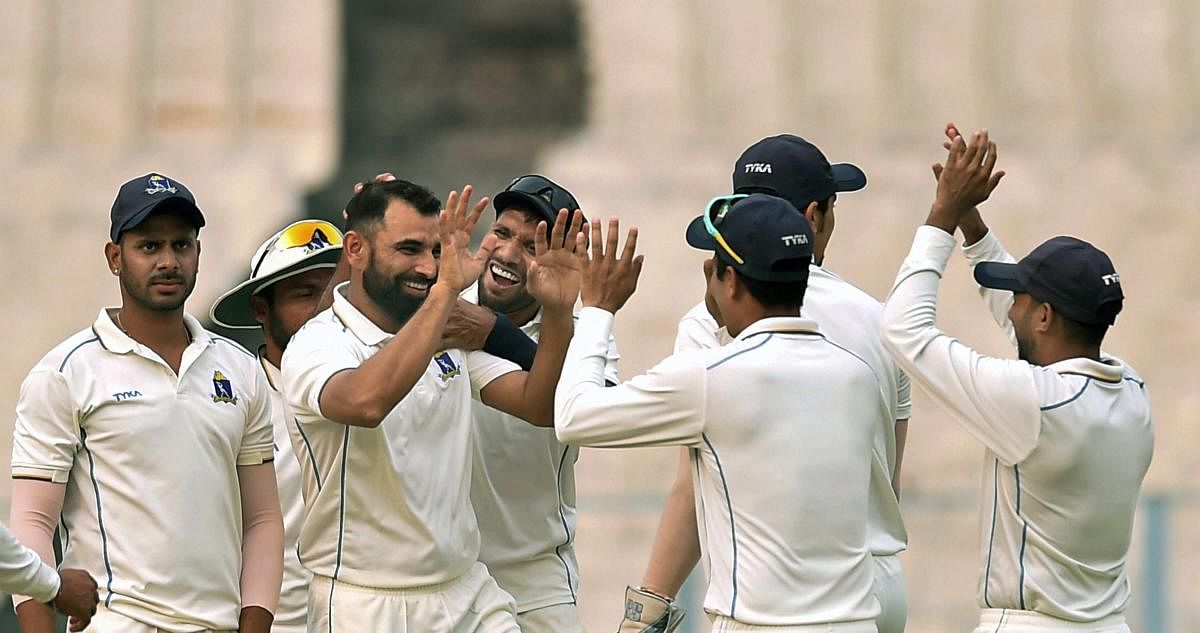 Bengal bowler Mohammad Shami celebrates with teammates after dismissing Kerala batsman KB Arun Karthik (not seen) during Ranji Trophy match, at Eden Garden in Kolkata. PTI Photo