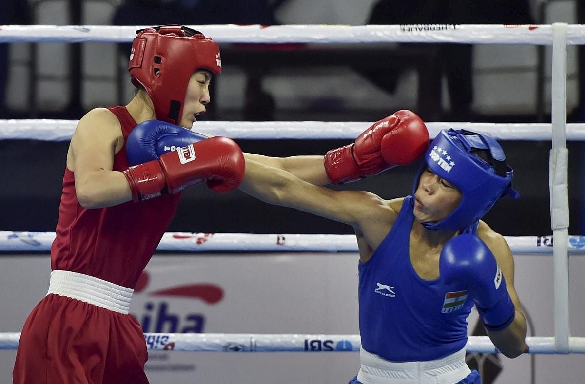 India’s Mary Kom exchanges punches with Hyang Kim of Peoples Republic of Korea in 45-48kg category during the AIBA Women's World Boxing Championships, in New Delhi.  PTI photo