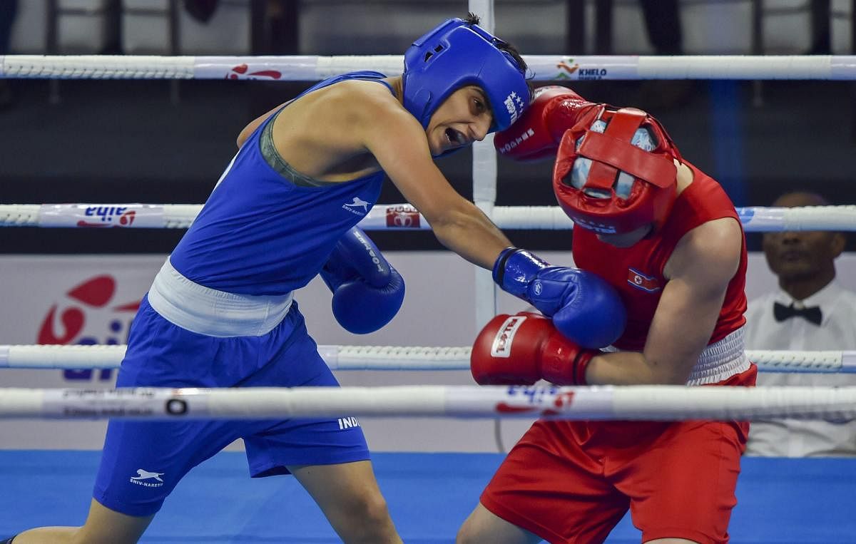 India's Sonia Chahal (in blue) punches her North Korean opponent Jo Son Hwa during their semifinal match of women's feather-weight 54-57 kg category at AIBA Women's World Boxing Championships, in New Delhi, Friday, Nov. 23, 2018. Chahal won the match. (PTI Photo/Manvender Vashist)