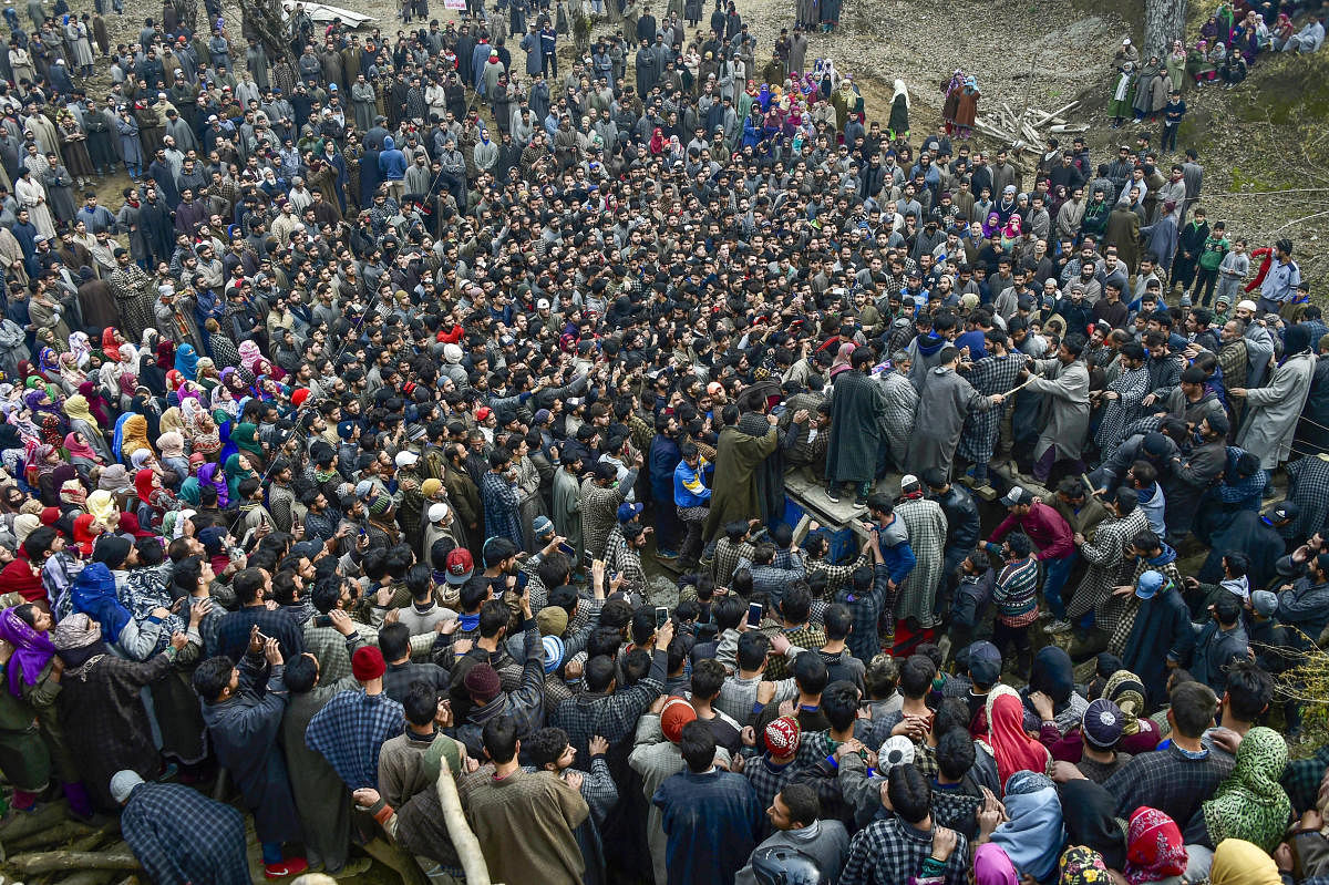 Tral: Villagers attend the funeral of one of the militants who belonged to the Ansar Ghazwatul Hind, an ISIS offshoot at Reshi Pora village, Tral of Pulwama District, Tuesday, Nov.27, 2018. Three militants, including one from an ISIS offshoot, and a soldier were killed while two jawans suffered injuries in two separate encounters in Jammu and Kashmir's Kulgam and Pulwama districts. (PTI Photo/S Irfan)