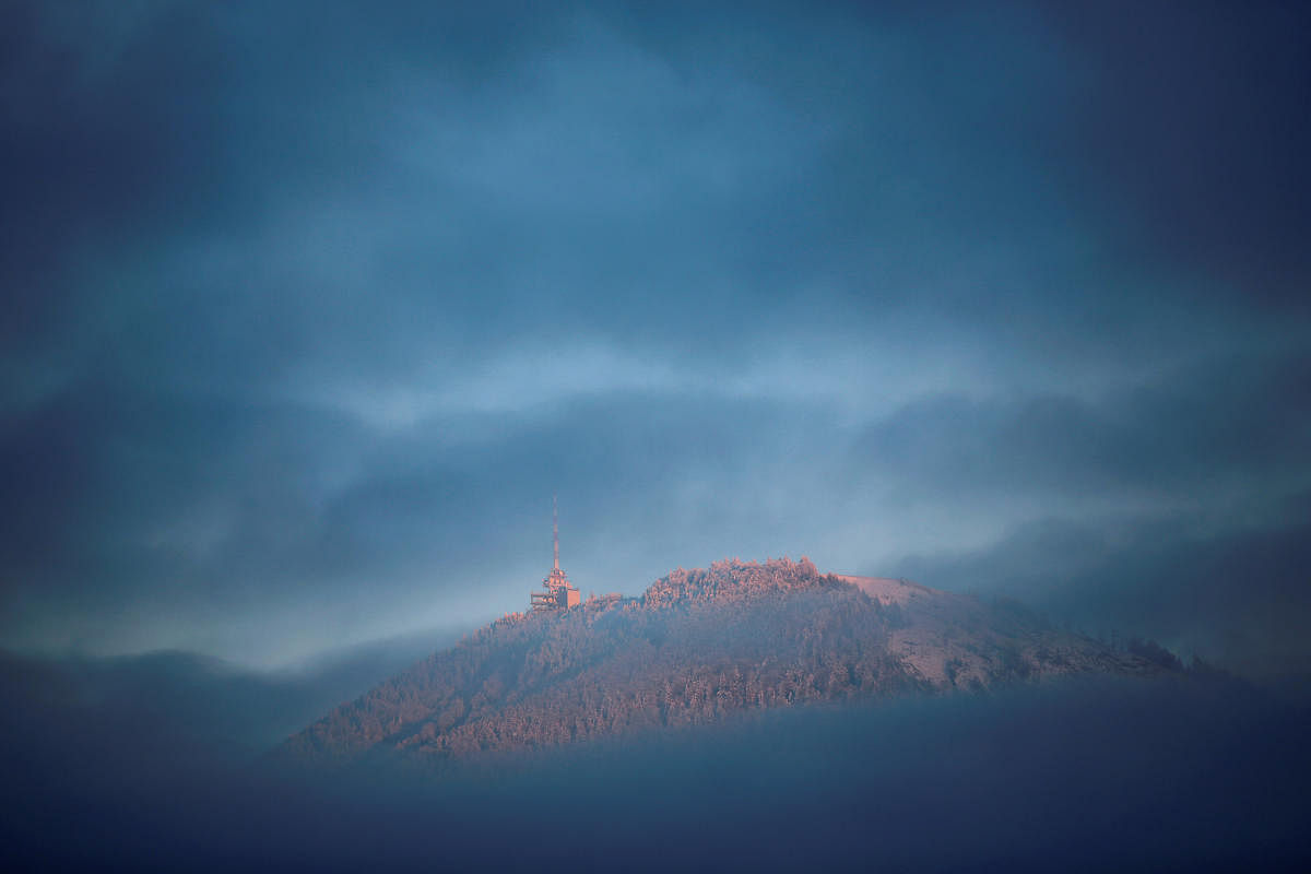 The Gaisberg mountain is seen between the clouds near Salzburg, Austria November 28, 2018. REUTERS/Leonhard Foeger