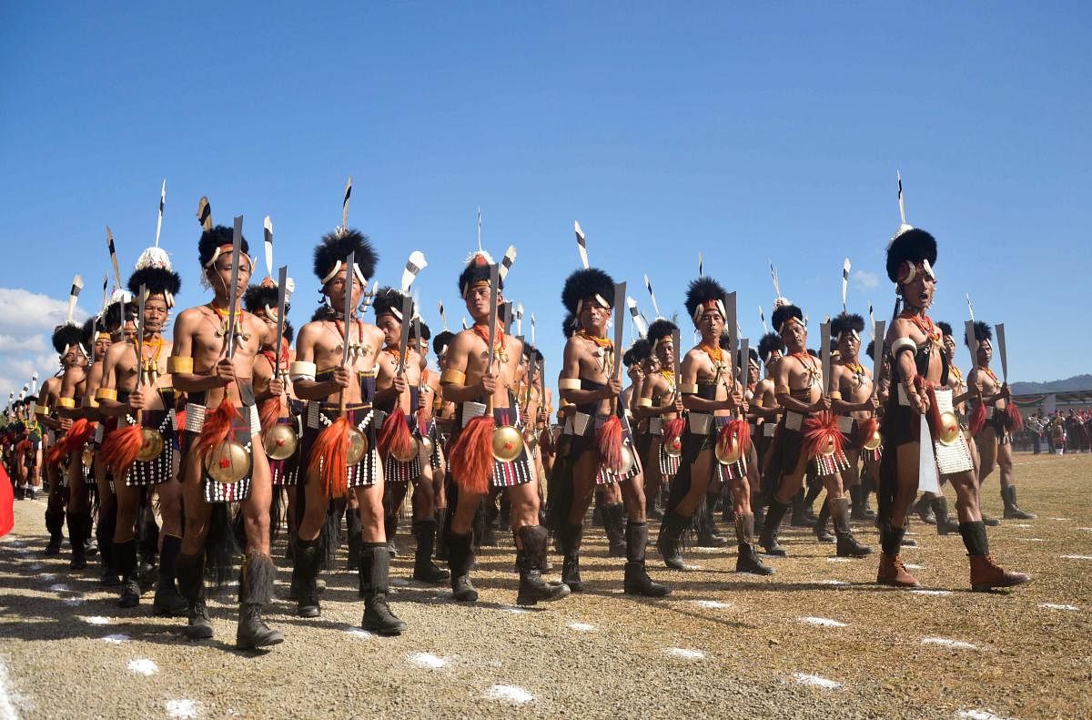 Contingents of Nagaland Village Guard march during the 55th Nagaland Statehood Day celebration in Kohima. (PTI Photo)
