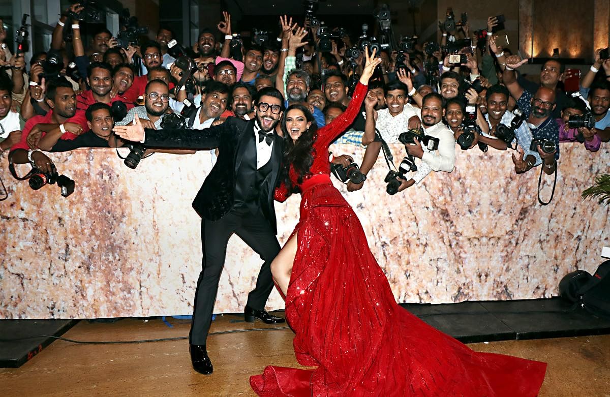 Ranveer Singh and Deepika Padukone pose for a photograph during their wedding reception party in Mumbai. (PTI Photo)