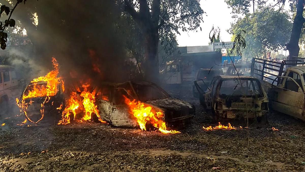 Vehicles set on fire by a mob during a protest over the alleged illegal slaughter of cattle, in Bulandshahr, Uttar Pradesh. (PTI Photo)