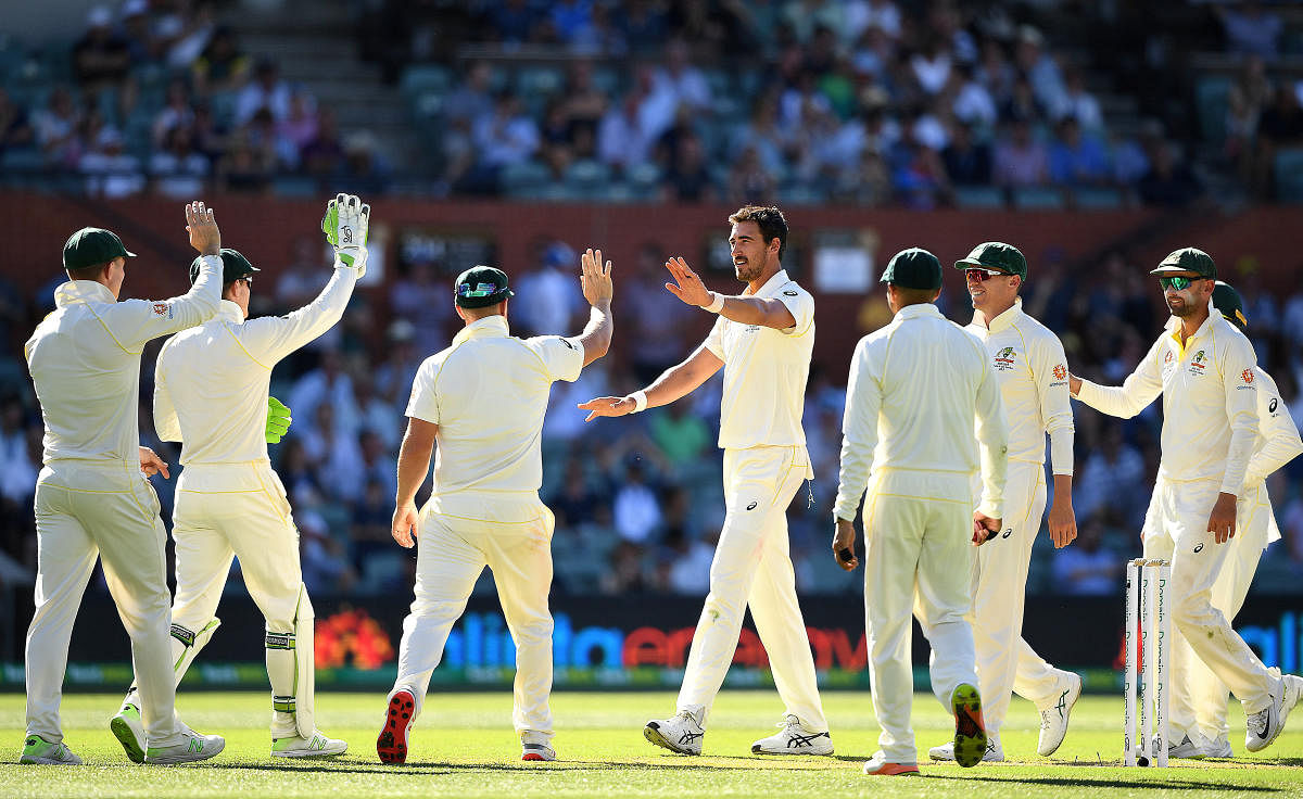 Mitchell Starc celebrates after taking a wicket during day one of the first test match between Australia and India at the Adelaide Oval in Adelaide, Australia. (Reuters Photo)