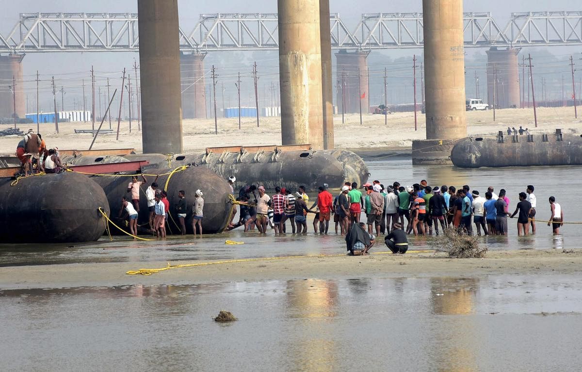 Labourers building a pontoon bridge, ahead of Kumbh Mela 2019 on river Ganga, in Allahabad. (PTI Photo)