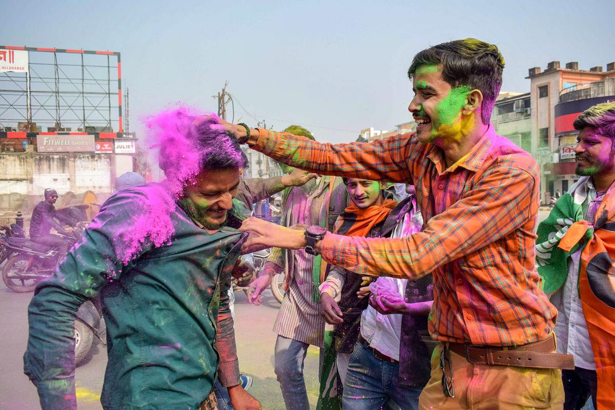 Congress party workers celebrate the party's performance in the Assembly elections of Rajasthan, Chhattisgarh and Madhya Pradesh, in Allahabad, Tuesday, Dec 11, 2018. (PTI Photo)