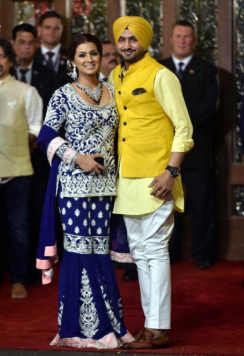 Cricketer Harbhajan Singh with wife Geeta Basra arrives to attend the wedding ceremony of industrialist Mukesh Ambani's daughter Isha with Anand Piramal at Ambani's residence, Antilia, in Mumbai, Wednesday, Dec. 12, 2018. (PTI Photo)