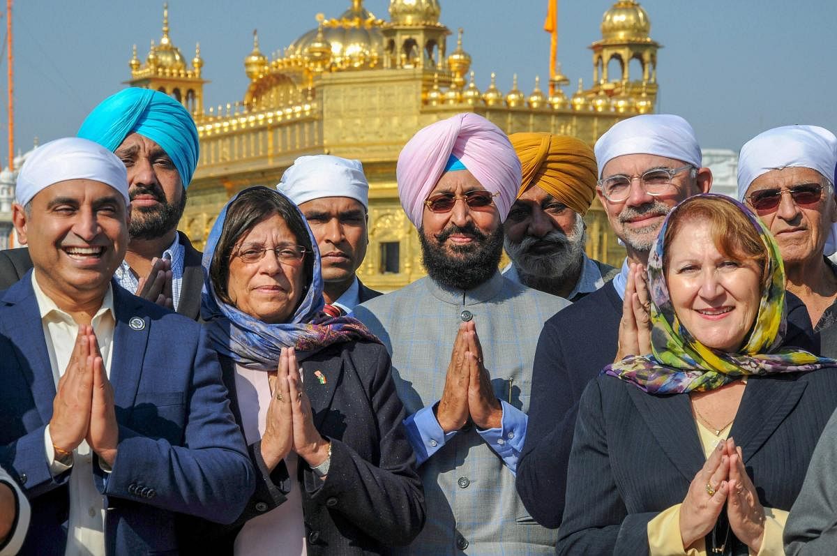 Senior Congress leader and Congress MP from Rajya Sabha Partap Singh Bajwa with a delegation of California State Assembly members at the Golden Temple in Amritsar. PTI photo