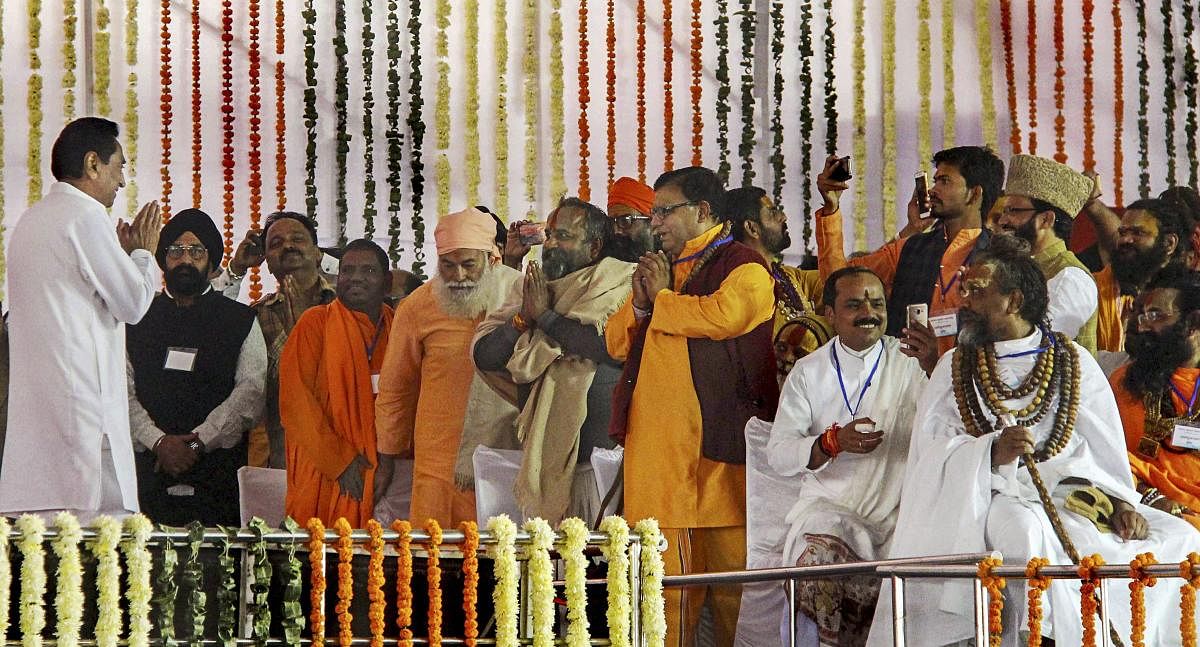 Newly sworn-in Madhya Pradesh Chief Minister Kamal Nath greets various religious leaders who attended his swearing-in-ceremony, in Bhopal, Monday, Dec. 17, 2018. (PTI Photo)