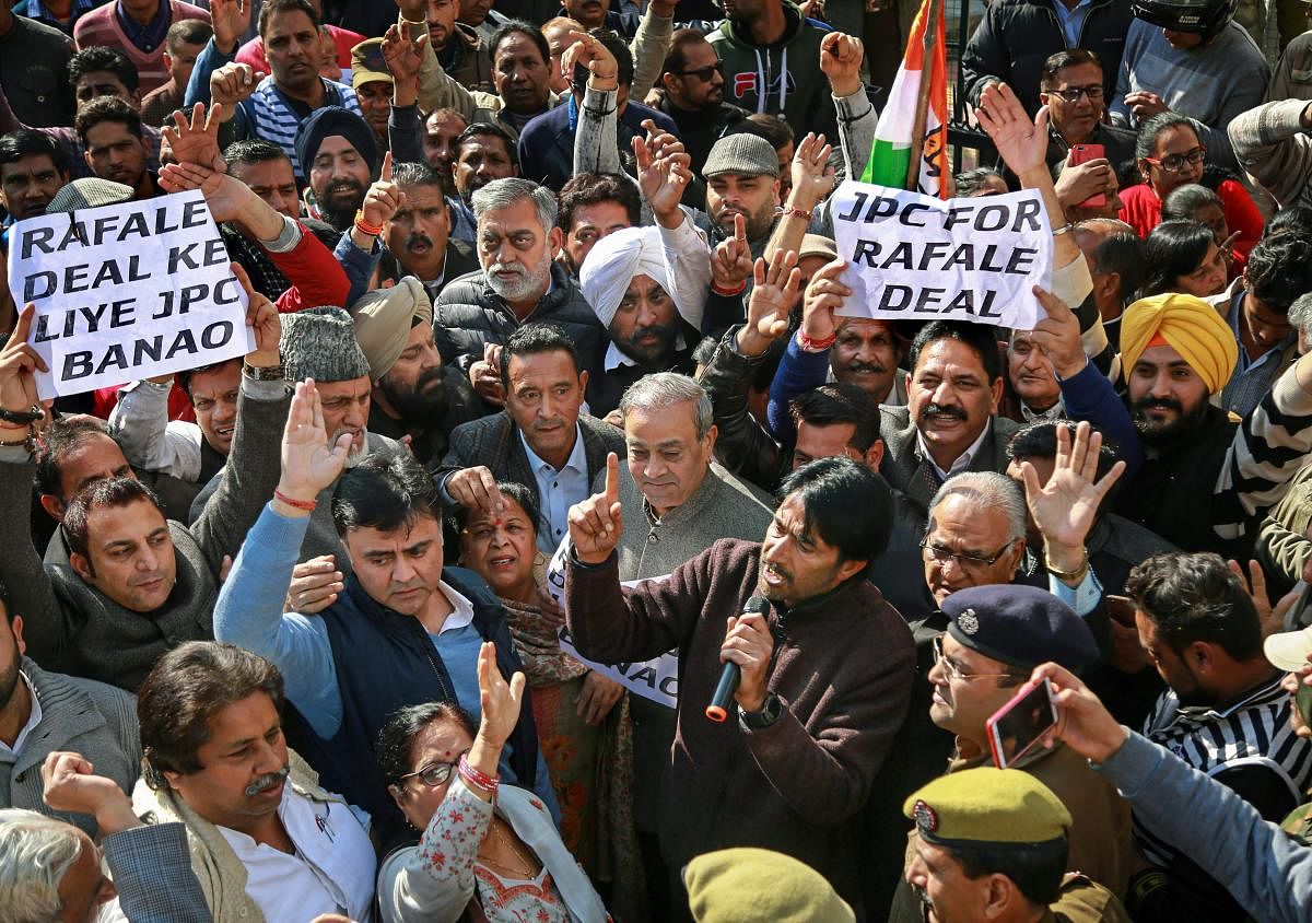 JKPCC President GA Mir with senior leaders raise slogans during a protest march in relation to Rafale Deal, in Jammu, Thursday, Dec. 20, 2018. (PTI Photo)
