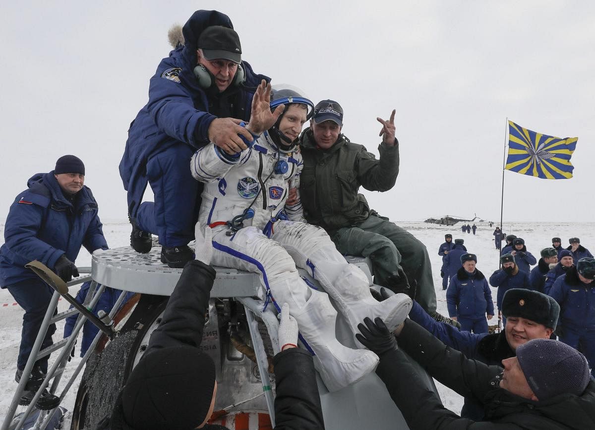 Ground personnel help International Space Station (ISS) crew member cosmonaut Sergey Prokopyev, of Russia, to get out of capsule after landing in a remote area outside the town of Zhezkazgan, formerly known as Dzhezkazgan, Kazakhstan, on Thursday, Dec. 20, 2018. Three astronauts have returned to Earth after more than six months aboard the International Space Station. AP/PTI