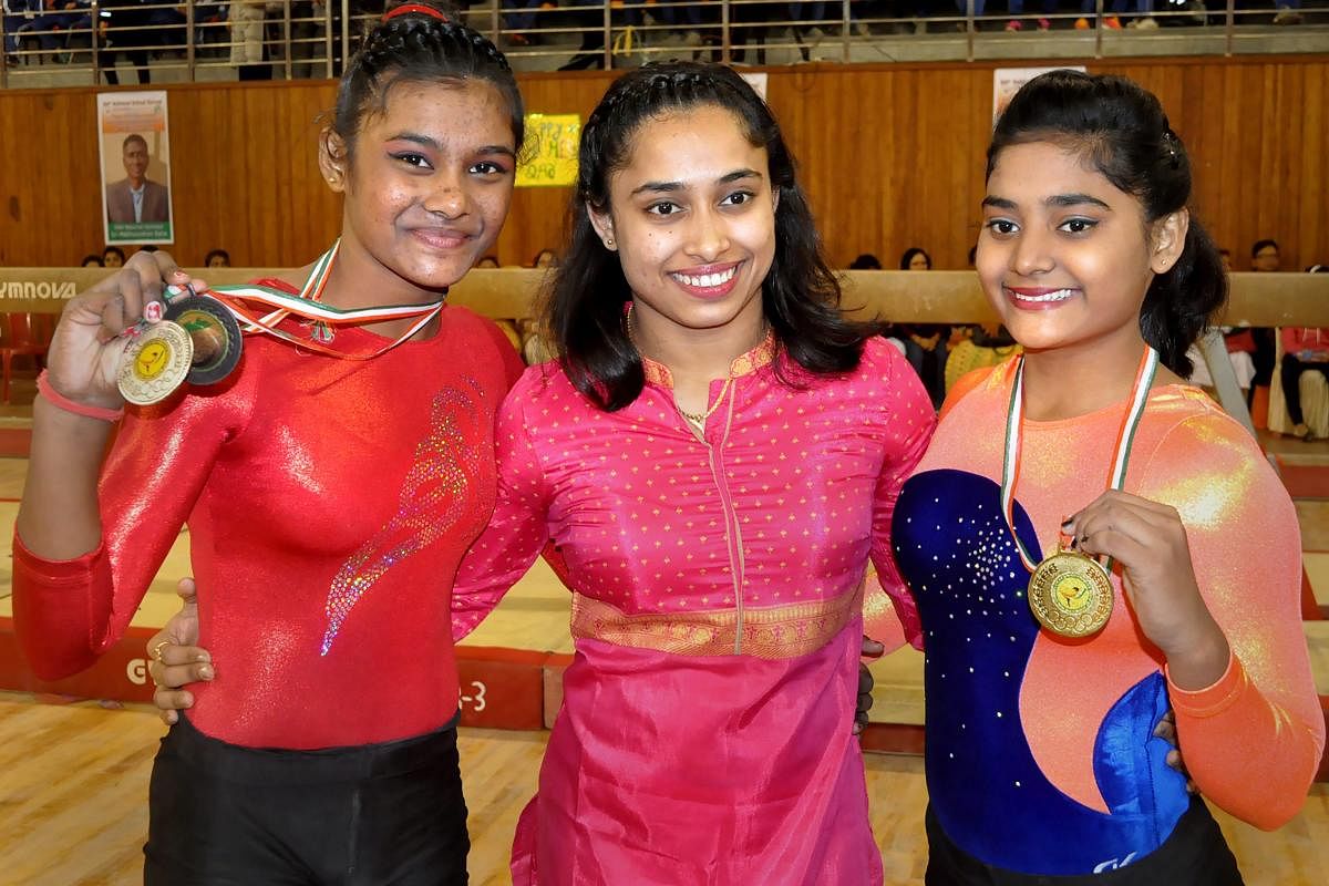 India's ace gymnast Dipa Karmakar flanked by winners of the 64th National Games, in Agartala, Wednesday, Dec. 19, 2018. (PTI Photo)