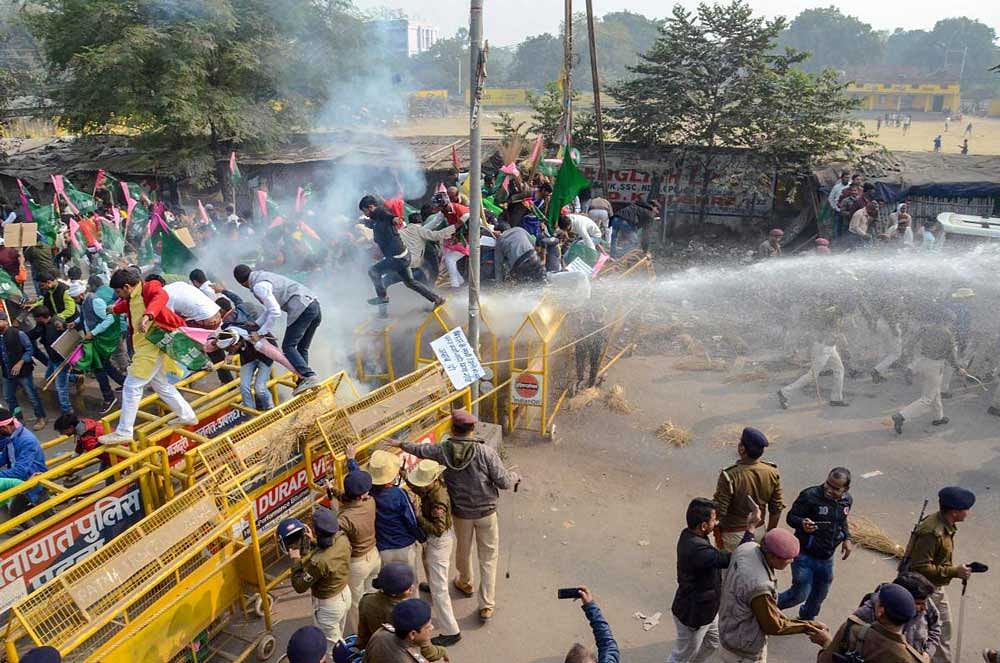 Police personnel use water cannon at Jan Adhikar Party activists during their march to Raj Bhawan for completion of various demands, in Patna. PTI Photo