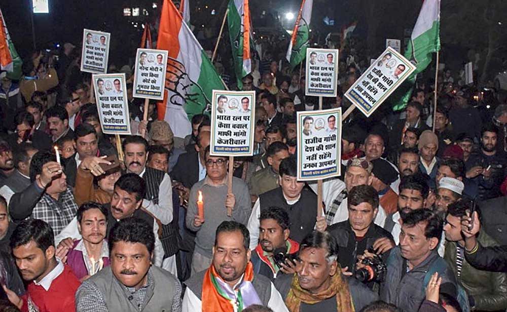 Congress Committee President Ajay Maken with party supporters protest against AAP government in relation to a resolution passed in Delhi Assembly, in New Delhi. Delhi Assembly passed a resolution demanding that Bharat Ratna awarded to former prime minister Rajiv Gandhi be withdrawn over the 1984 anti-Sikh riots. PTI Photo