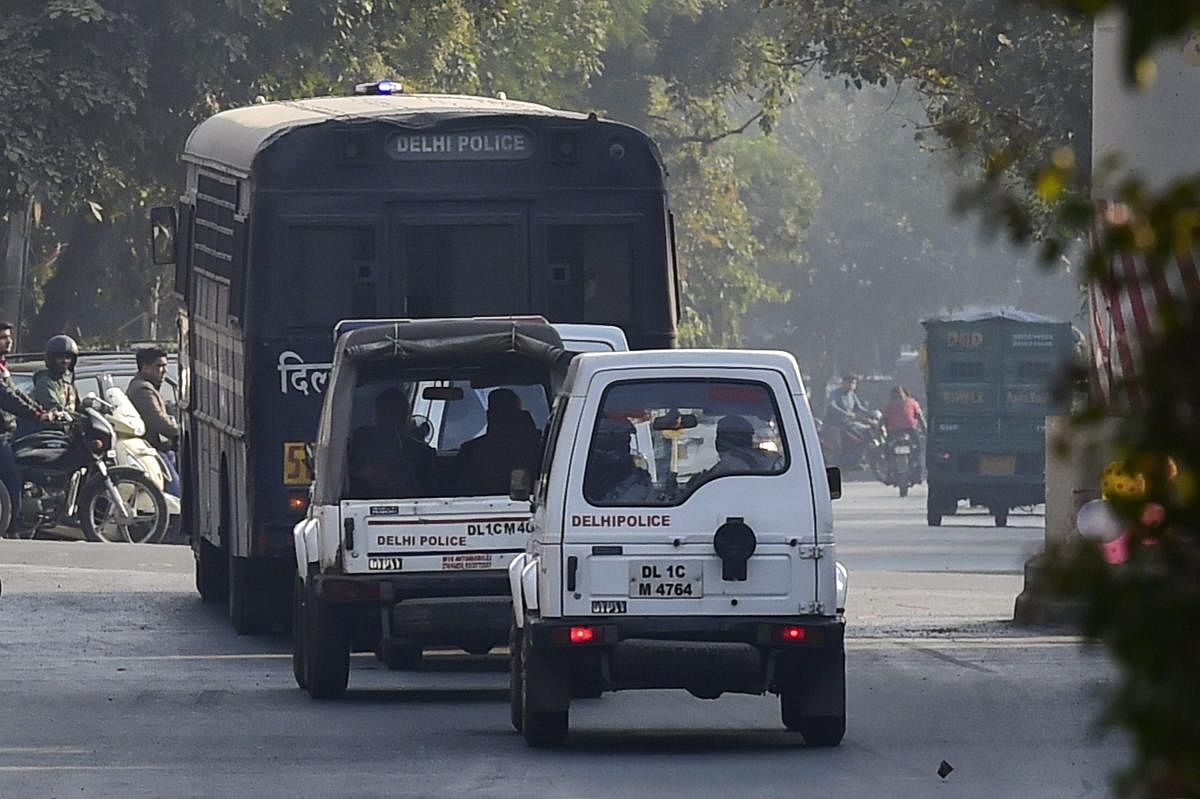 A police van carrying Congress leader Sajjan Kumar, who was awarded life sentence by Delhi High Court in 1984 anti-Sikh riots case, being taken away after he surrendered in Karkardooma Court in New Delhi. PTI