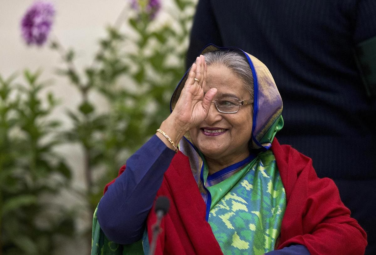 Bangladeshi Prime Minister Sheikh Hasina greets the gathering in Dhaka, Bangladesh, Monday, Dec. 31, 2018. Bangladesh's ruling alliance won virtually every parliamentary seat in the country's general election, according to official results released Monday, giving Hasina a third straight term despite allegations of intimidation and the opposition disputing the outcome. AP/PTI