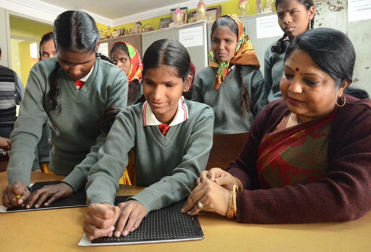 Visually-impaired student write braille characters on the 210th birth anniversary of its French inventor Louis Braille, at Netraheen Kanya Vidyalaya, in Jabalpur, Friday, Jan 4, 2019. (PTI Photo)