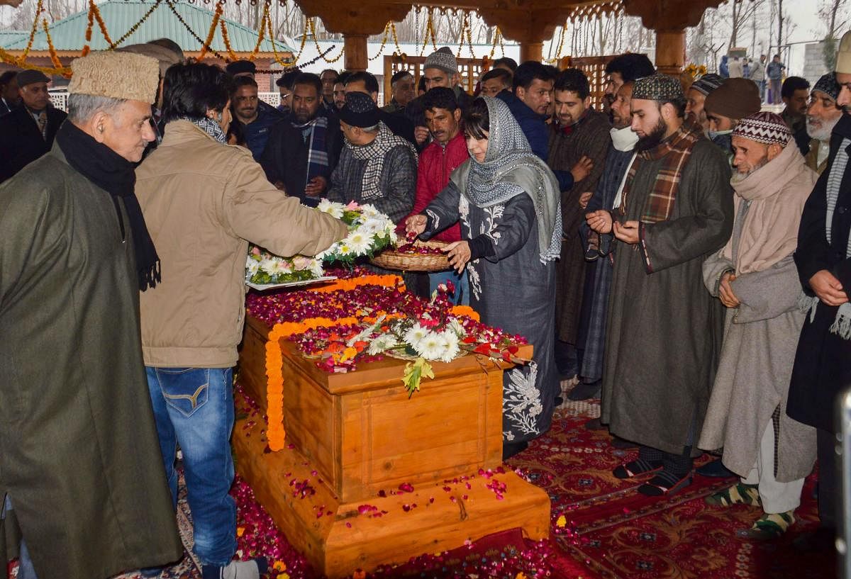 Former Jammu & Kashmir chief minister and PDP President Mehbooba Mufti along with senior party leader pays floral tribute at the grave of her father and party patron Mufti Muhammad Syed on his third death anniversarry, at Bijbehara in Anantang district of south Kashmir, Monday, Jan 7, 2019. (PTI Photo)