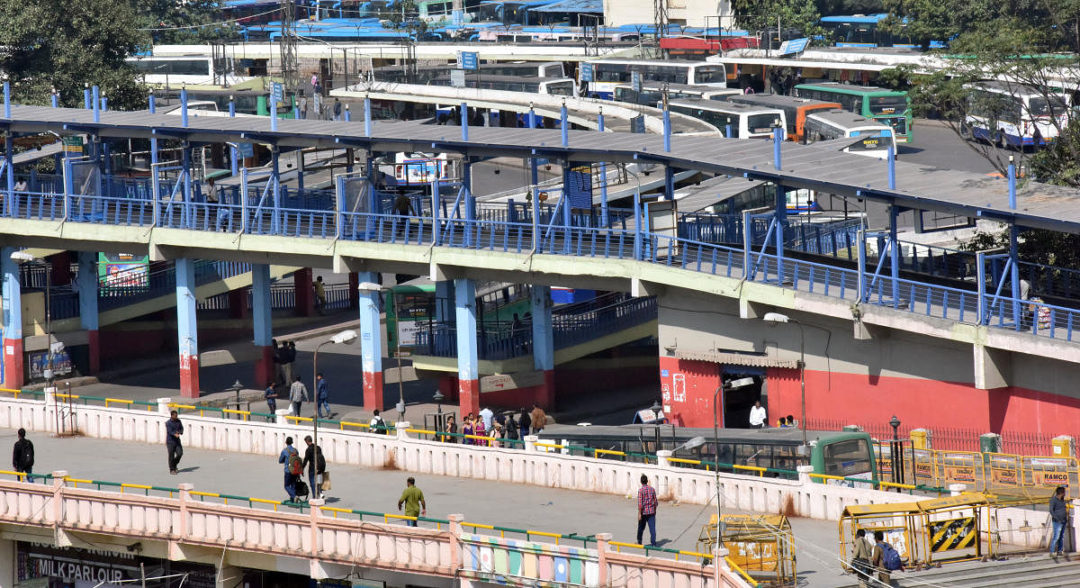 Fewer commuters seen at the BMTC bus station at Majestic during the nationwide strike called by Central trade unions against the alleged anti-labour policies of the central government in Bengaluru on Tuesday. (DH Photo by Janardhan B K)