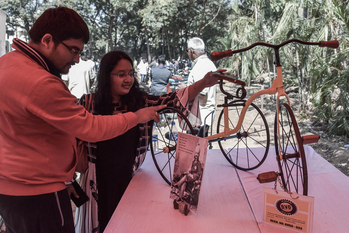 Visitors look at an exhibit at the Southern India Vintage and Classic Automobile meet organised by The Bangalore Vintage Group at The Jayamahal Palace in Bengaluru on Sunday. (DH Photo by S K Dinesh)