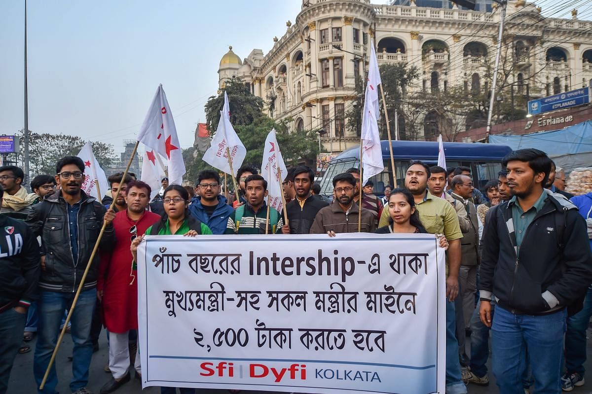 Students' Federation of India (SFI) and Democratic Youth Federation of India (DYFI) activists raise slogans during a protest, in Kolkata. PTI photo