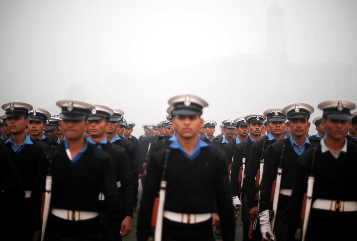 Indian Navy soldiers rehearse for the Republic Day parade on a foggy winter morning in New Delhi. (Reuters Photo)
