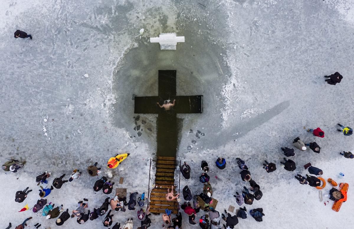 An Orthodox believer bathes in the icy water on Epiphany in Kiev, Ukraine. Epiphany celebrates the revelation of Jesus Christ as the incarnation of God through his baptism in the River Jordan. (AP/PTI Photo)