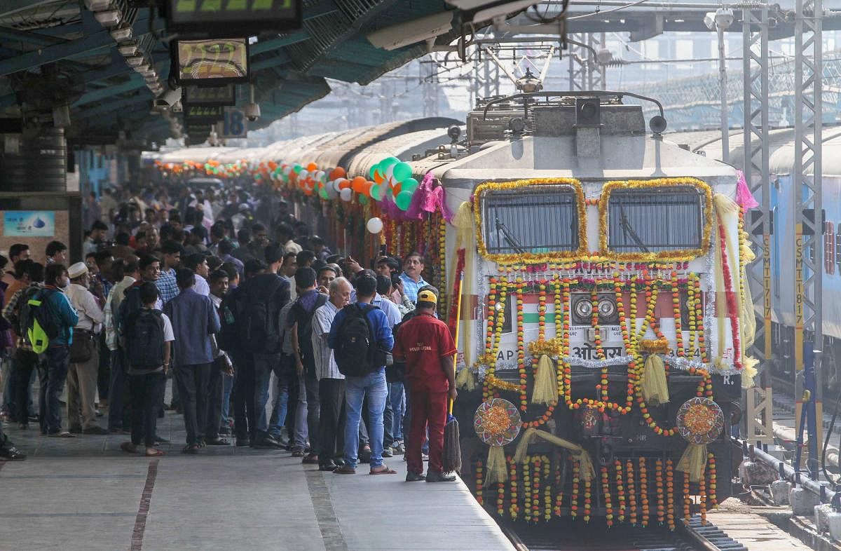 Railway Minister Piyush Goyal flags-off the new CSMT - Hazrat Nizamuddin Express train, at CSMT in Mumbai. (PTI Photo)