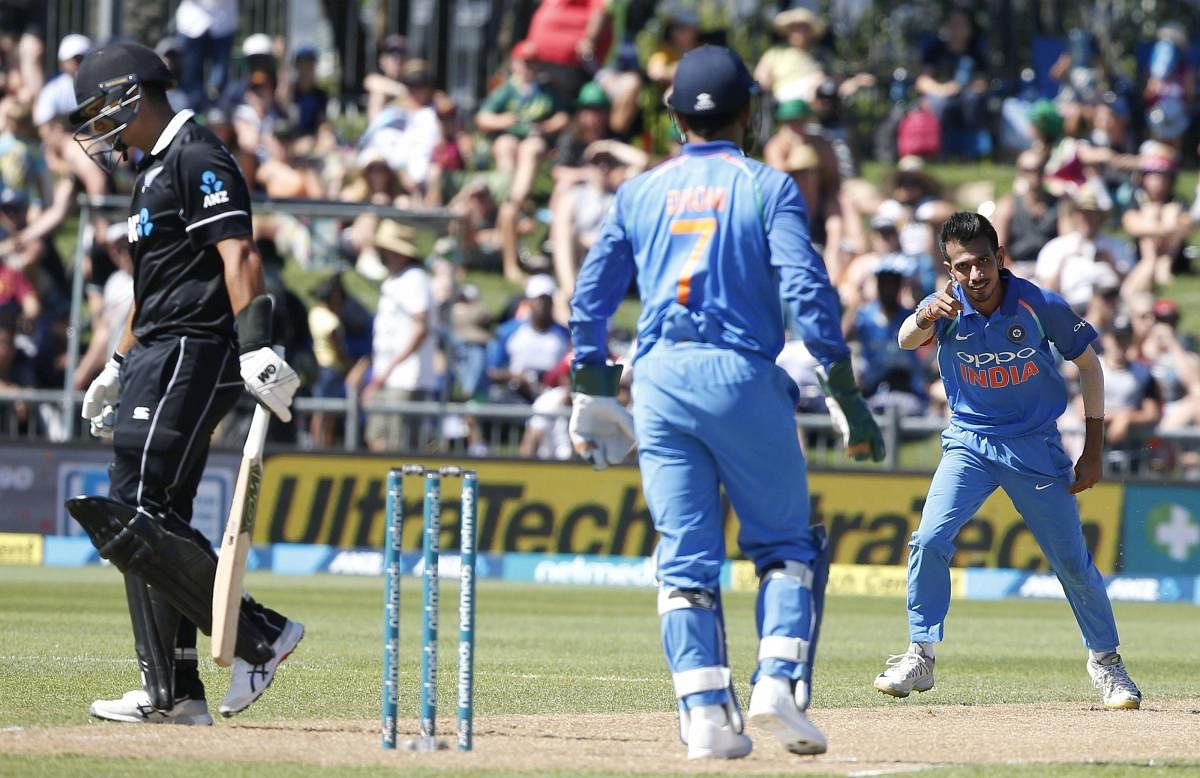 Yuzvendra Chahal celebrates dismissing New Zealand's Ross Taylor with MS Dhoni during a one day international cricket match between New Zealand and India in Napier, New Zealand. (AP/PTI Photo)