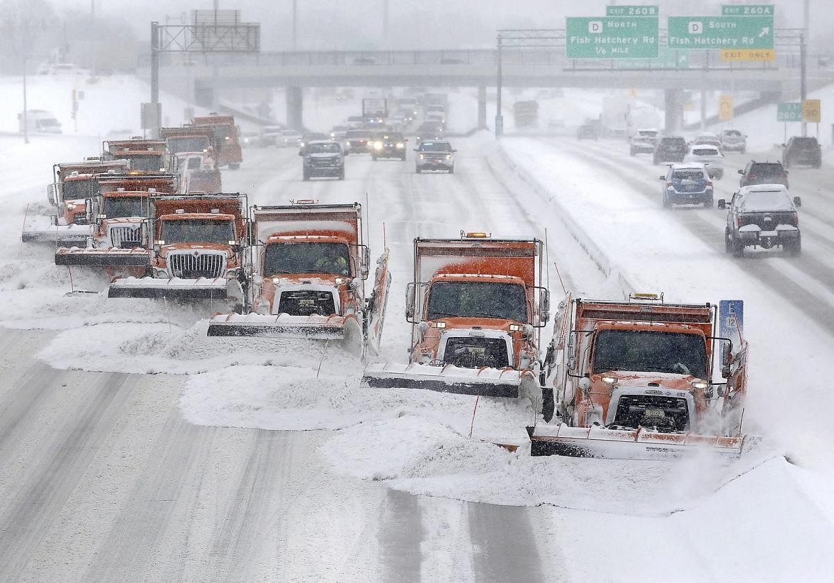 Snow plows clears snow from the westbound lanes of U.S. Highway 12/18 in Madison, Wisconsin. (AP/PTI Photo)