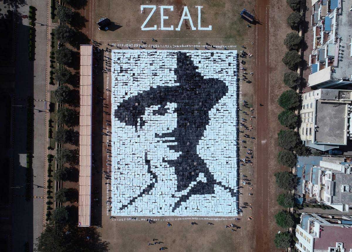 Students hold placards to create a portrait of freedom fighter Bhagat Singh on the eve of Republic day celebration, in Pune, Friday, Jan 25, 2019. (PTI Photo)