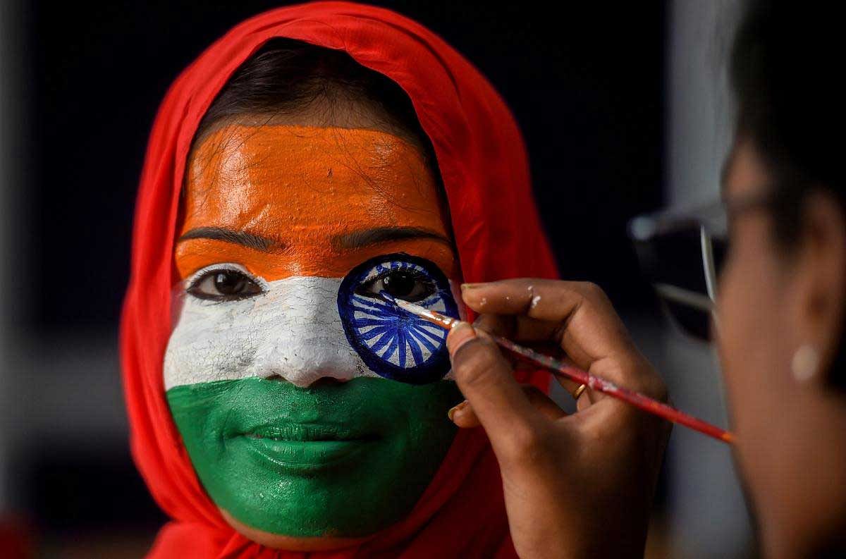 A college student gets her face painted during Republic Day celebrations, in Chennai, Friday, Jan. 25, 2019. (PTI Photo)