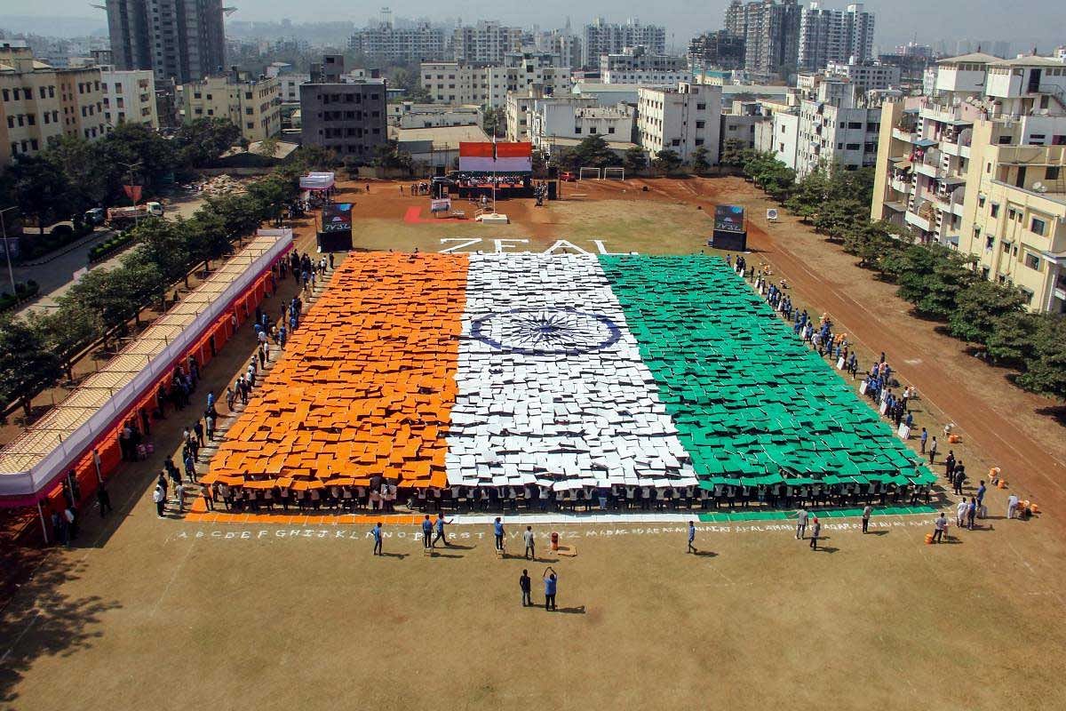 Students form a human chain to resemble the Indian national flag on the eve of the Republic Day in Pune, Friday, Jan 25, 2019. (PTI Photo)