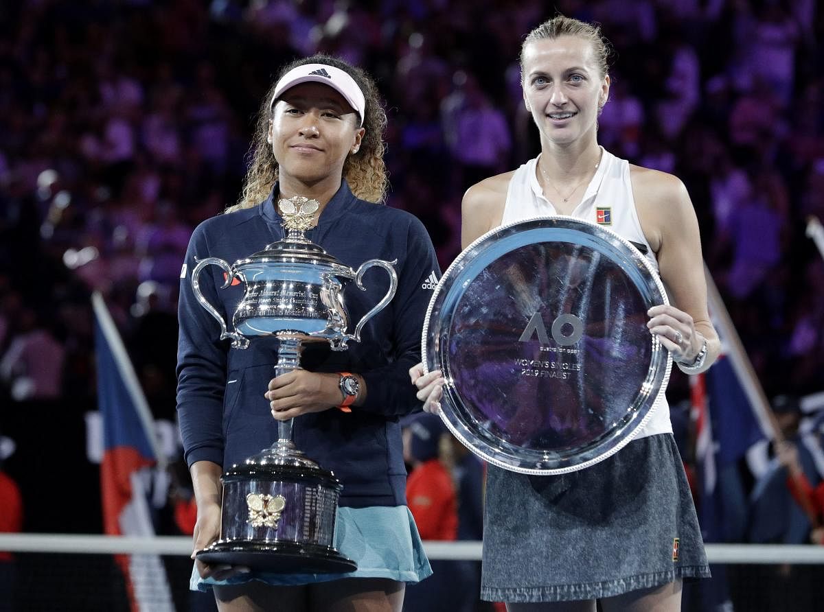 Japan's Naomi Osaka, left, holds her trophy after defeating Petra Kvitova, right, of the Czech Republic in the women's singles final at the Australian Open tennis championships in Melbourne, Australia, Saturday, Jan. 26, 2019. AP/PTI