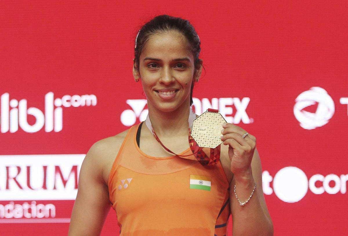 India's Saina Nehwal poses with the gold medal after winning against Spain's Carolina Marin during the final round of the women's single match of the Indonesia Masters badminton tournament at Istora Stadium in Jakarta, Indonesia, Sunday, Jan. 27, 2019. AP/PTI