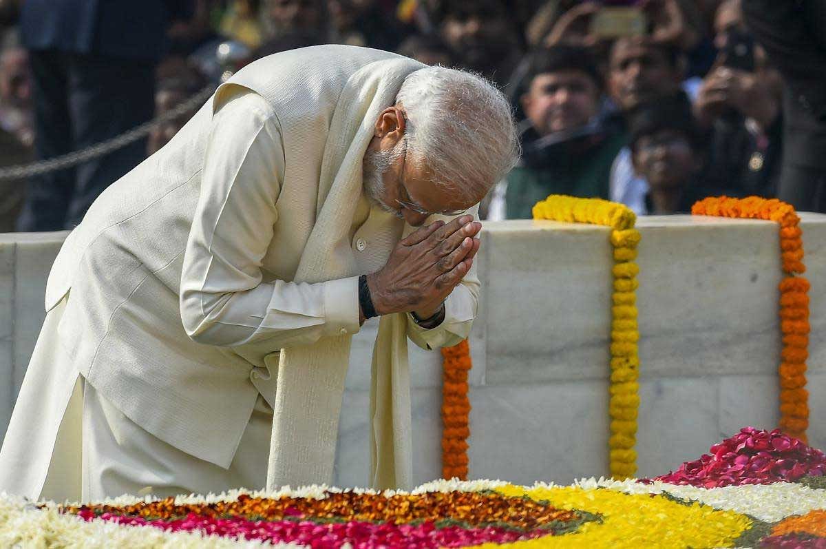 Prime Minister Narendra Modi pays homage to Mahatma Gandhi on his 71st death anniversary, also observed as Martyrs' Day, at Rajghat in New Delhi, Wednesday, Jan. 30, 2019. (PTI Photo)