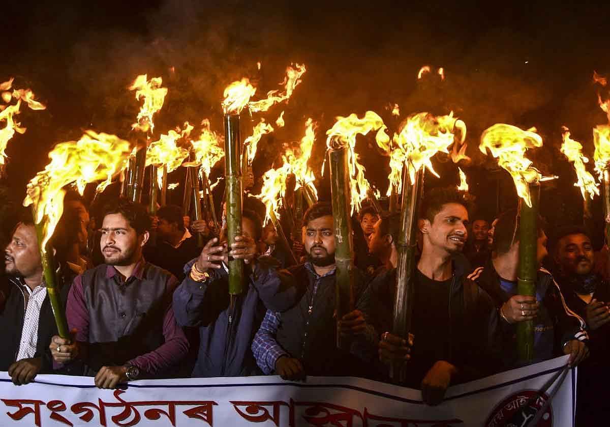 Activists of All Assam Students Union (AASU) and other organizations take part in a torch light rally procession to protest against the Citizenship (Amendment) Bill 2016, in Guwahati, Thursday, January 31, 2019. (PTI Photo)